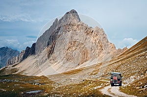 Off road caravain driving on a narrow path near the Rocca La Meja, italy photo