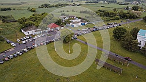 Off-road competition. SUV cars parking at meeting point before challenge. Aerial view.
