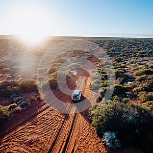 Off road desert adventure, car and tracks on sand in the Australian Outback.