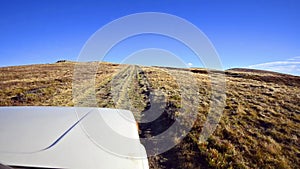 Off-road driving through a mountain plateau