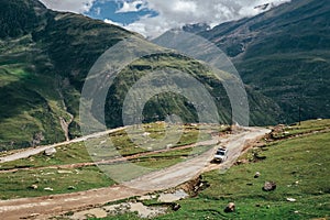 Off road expedition vehicle on the mountain road among Himalaya