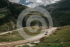 Off road expedition vehicle on the mountain road among Himalaya