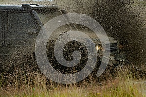 Off road jeep expedition to the villages on mountain road. Motion the wheels tires and off-road that goes in the dust.