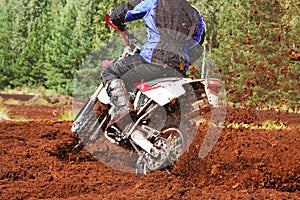 Off-road motorbike cornering in dirt