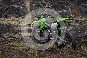 Off-road motorcycle parked in field