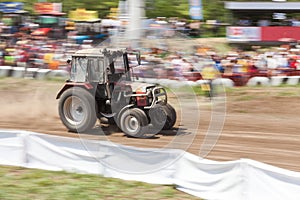 Off-road racing car driving at high speed on a dirt road with a smeared background. The concept of extrieme offroad