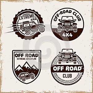 Off road set of four vector emblems, badges, labels or logos in vintage style with removable textures on separate layer