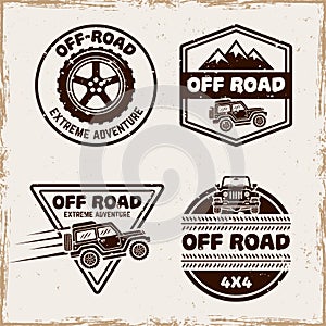 Off road and suv car set of four vector emblems, badges, labels or logos in vintage style with removable textures on