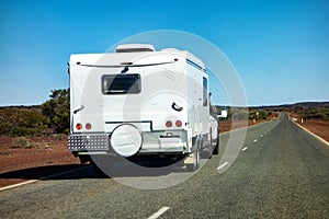 An off-road SUV car towing a caravan in Western Australia