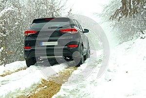 Off-road SUV in mud and snow