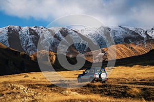 Off-road travel on car on mountain road in Caucasus, Georgia.