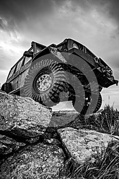 Off-road travel on mountain road. Car tire. Tire for offroad. Offroad vehicle stuck on impenetrable road after rain in