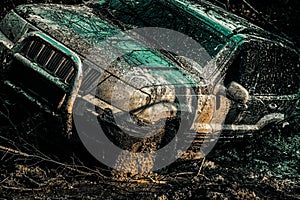 Off-road travel on mountain road. Off road sport truck between mountains landscape. Jeep crashed into a puddle and