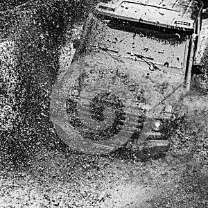 Off-road travel on mountain road. Tracks on a muddy field. Mudding is off-roading through an area of wet mud or clay photo