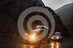 Off-road travel on 4x4 jeep car in mountains. Team of adventurers. Altay mountains, tourist in Siberia, nature views of Russia.