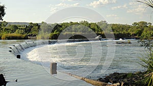 Off-road truck driving the Ivanhoe Crossing, Kununurra, Western Australia, Australia. A concrete causeway over Ord River photo