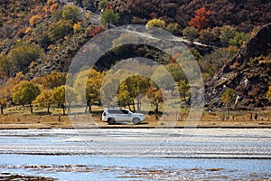 Off-road vehicle Driving on River Beach