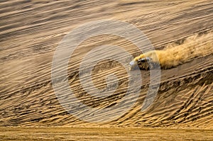 Off-road vehicle driving in the sand desert photo