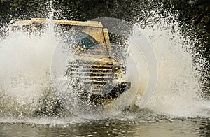 Off-road vehicle goes on the mountain. Tires in preparation for race. Expedition offroader. Jeep outdoors adventures