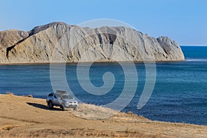 off-road vehicle on the high coast of the sea