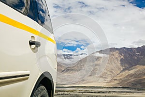 Off-road vehicle in mountain scene in Leh,India.