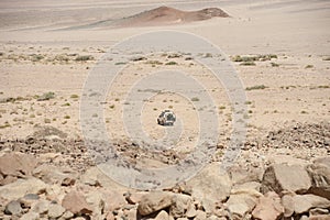 Off-road vehicle parked in an arid desert