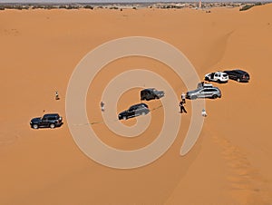 Off-road vehicles being stuck in the Erg Chebbi desert near Merzouga