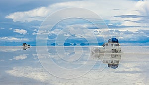 Off-road vehicles driving in Salar de Uyuni, Bolivia