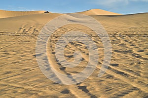 Off road vehicle tracks in sand at Imperial Sand Dunes, California, USA