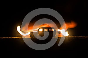 Off roader jeep silhouette on dark toned foggy sky background. Car with light at night