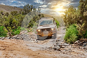 Off roading with an all terrain vehicle through a dry riverbed in The Arkaroola Wilderness Sanctuary