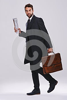 Off to work. Studio shot of a handsome and well-dressed young man.