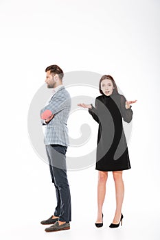 Offence young loving couple standing isolated photo