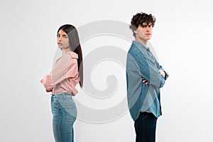 Offended Couple After Conflict Standing Over White Background In Studio