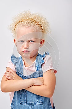 offended girl put hands one by one. cute child is offended and angry. Girl on white background
