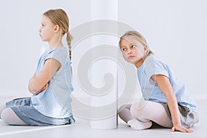 Offended girl and twin sister