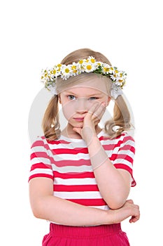 Offended girl with wreath of daisies