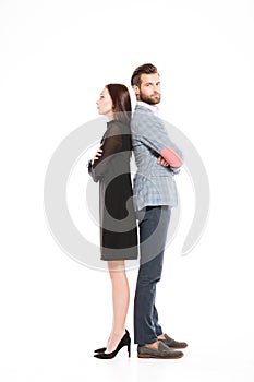 Offended loving couple standing isolated