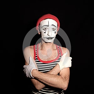 Offended mime with arms crossed