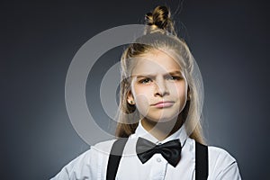 Offense girl isolated on gray background. Negative emotion. Closeup