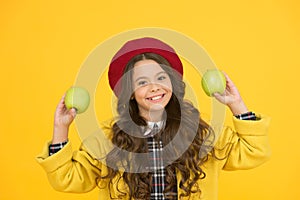 Offering healthy food in school. Happy child hold apples yellow background. Healthy school snack. Dieting plan for