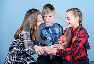 Offering healthy foods for kids. Little children holding red apples. Cute children with healthy apple snack. Small group