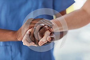 Offering a patient the care and comfort they need. Closeup shot of a medical practitioner holding a patients hand in