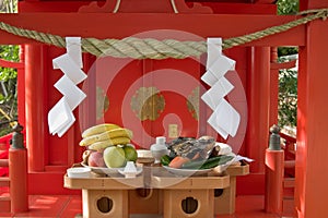 Offerings of food left at a Japanese shinto shrine