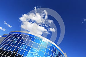 Office building on a background of blue sky with clouds