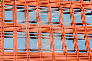 Office building with bright orange front.