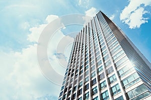 Office building with clear blue sky in background.