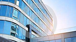 Office building, details of blue glass wall and sun reflections.