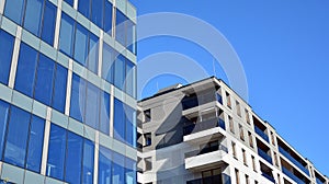 Office building, details of blue glass wall and sun reflections.