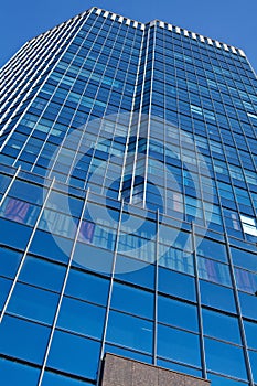 Office building over blue sky background